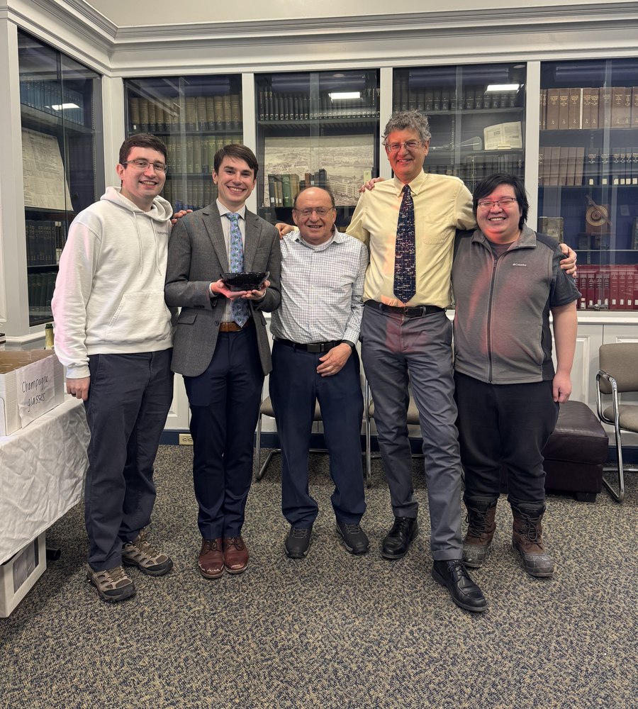 Group members and Meers Oppenheim celebrating a PhD graduation.